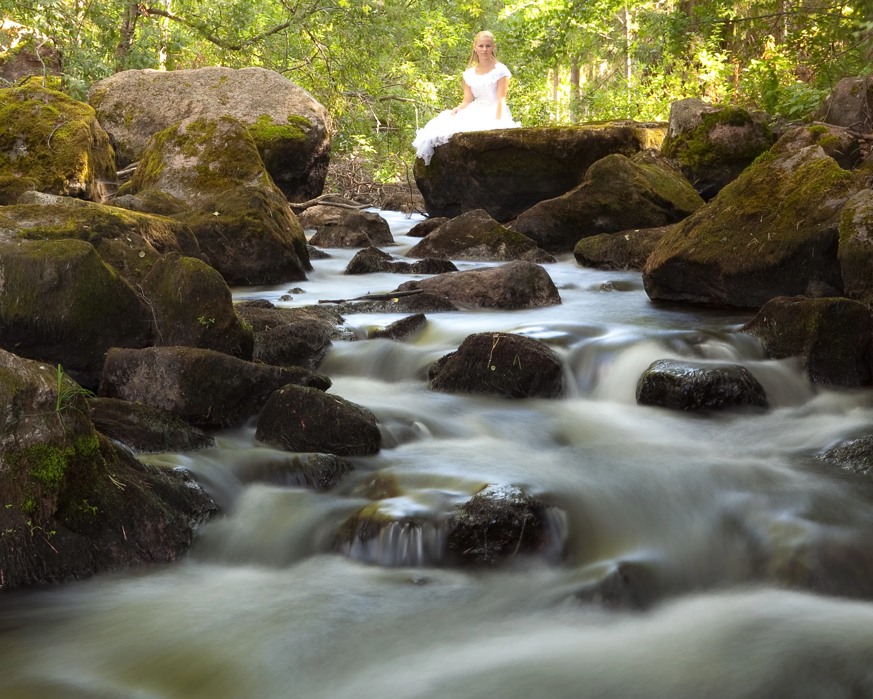 Ruth by a stream in a forest