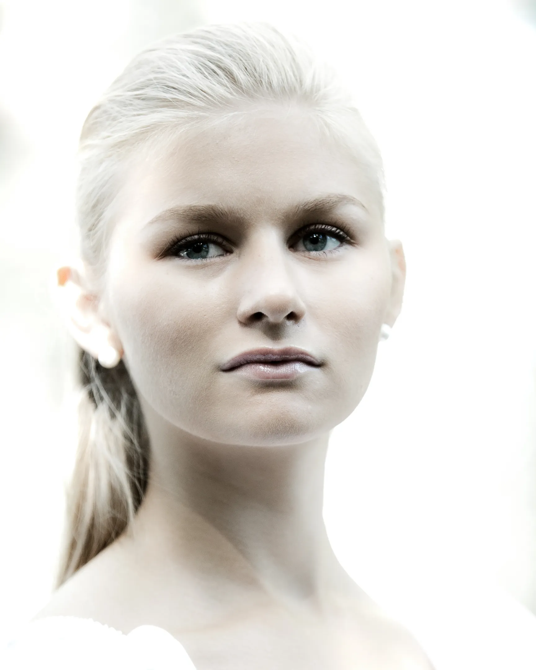 Ruth in ethereal high-key portrait with slicked-back hair