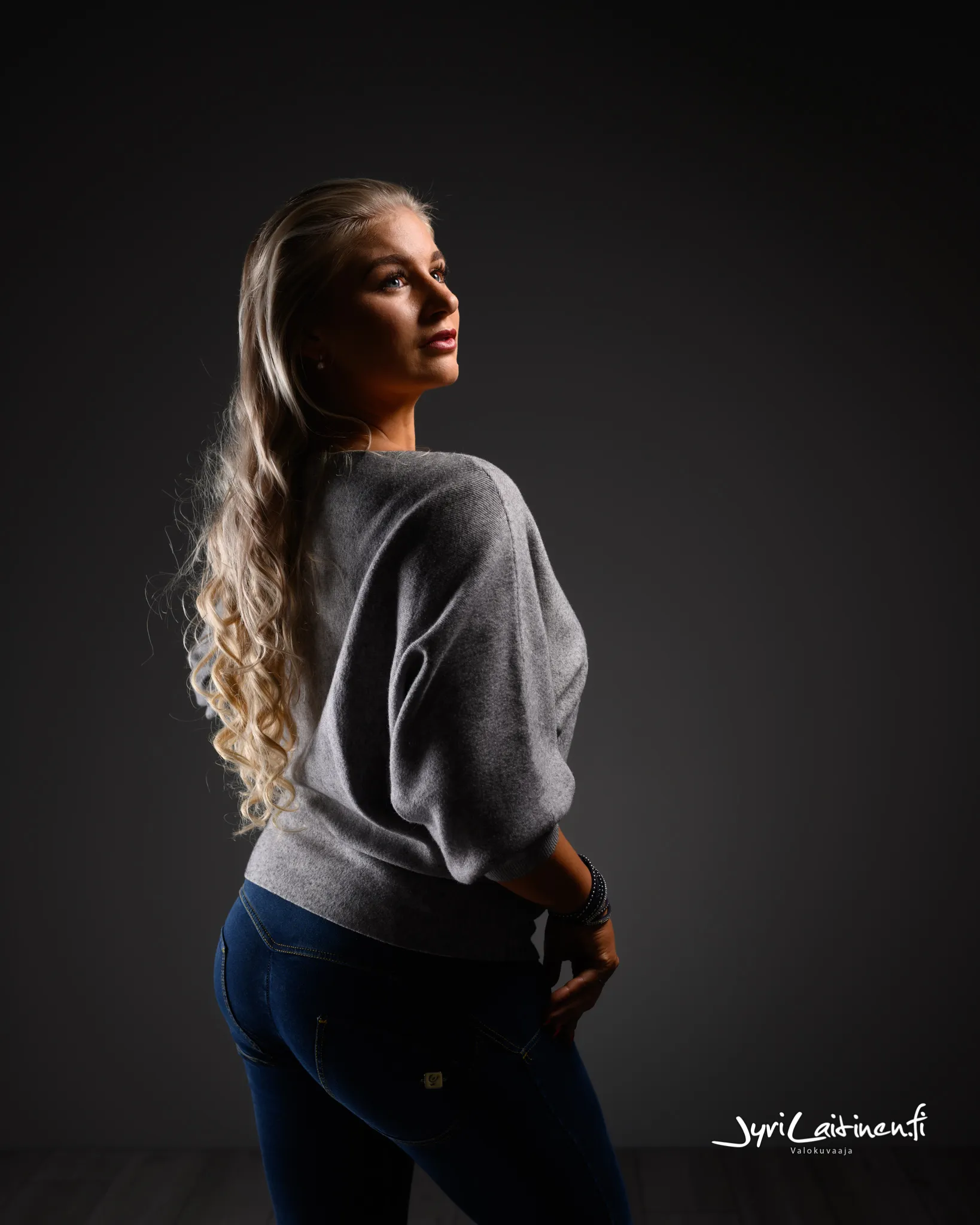 Ruth in a studio portrait with casual styling