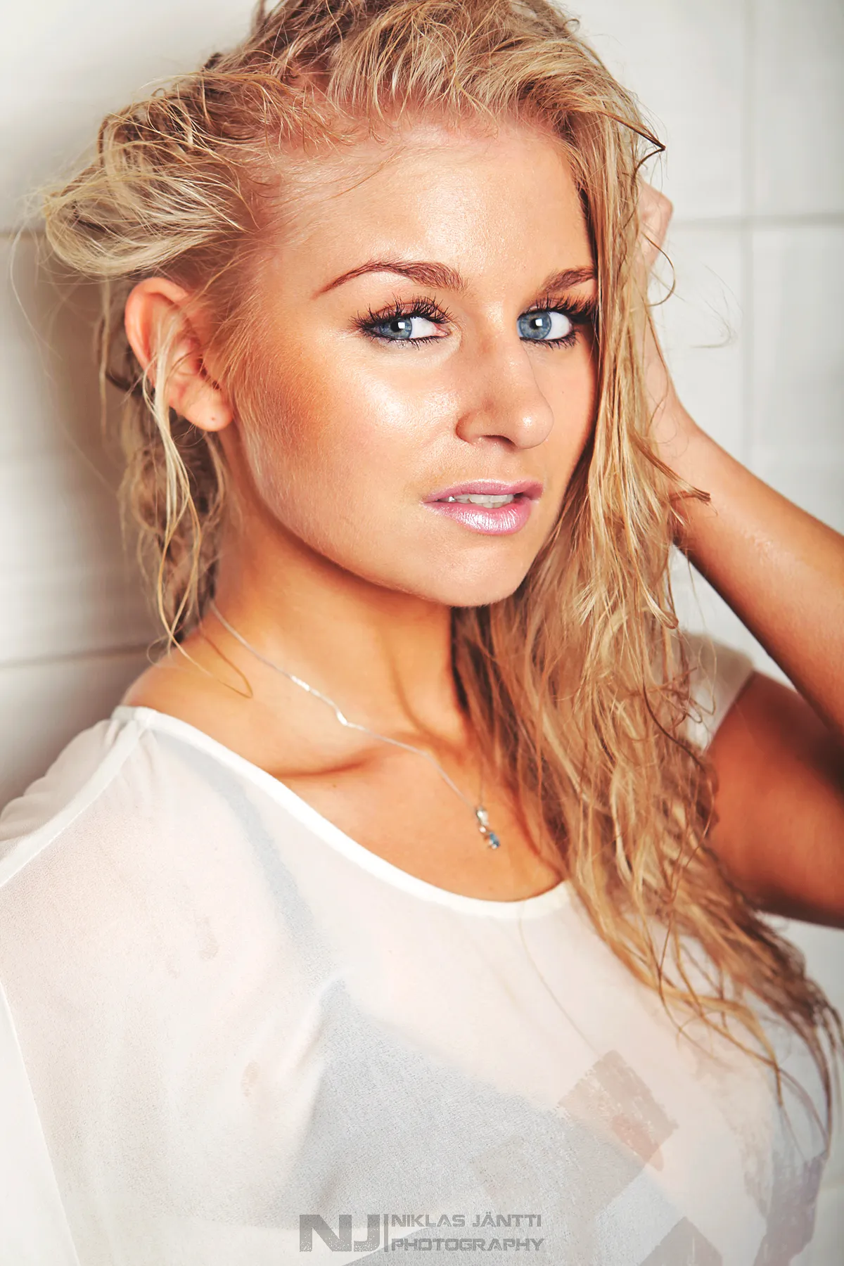 Ruth wet-hair beauty portrait with blue eyes, close crop