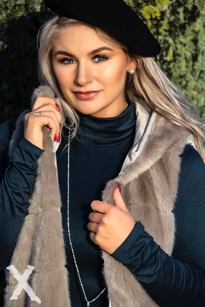 Ruth in beret and fur vest, autumn close-up with red nails