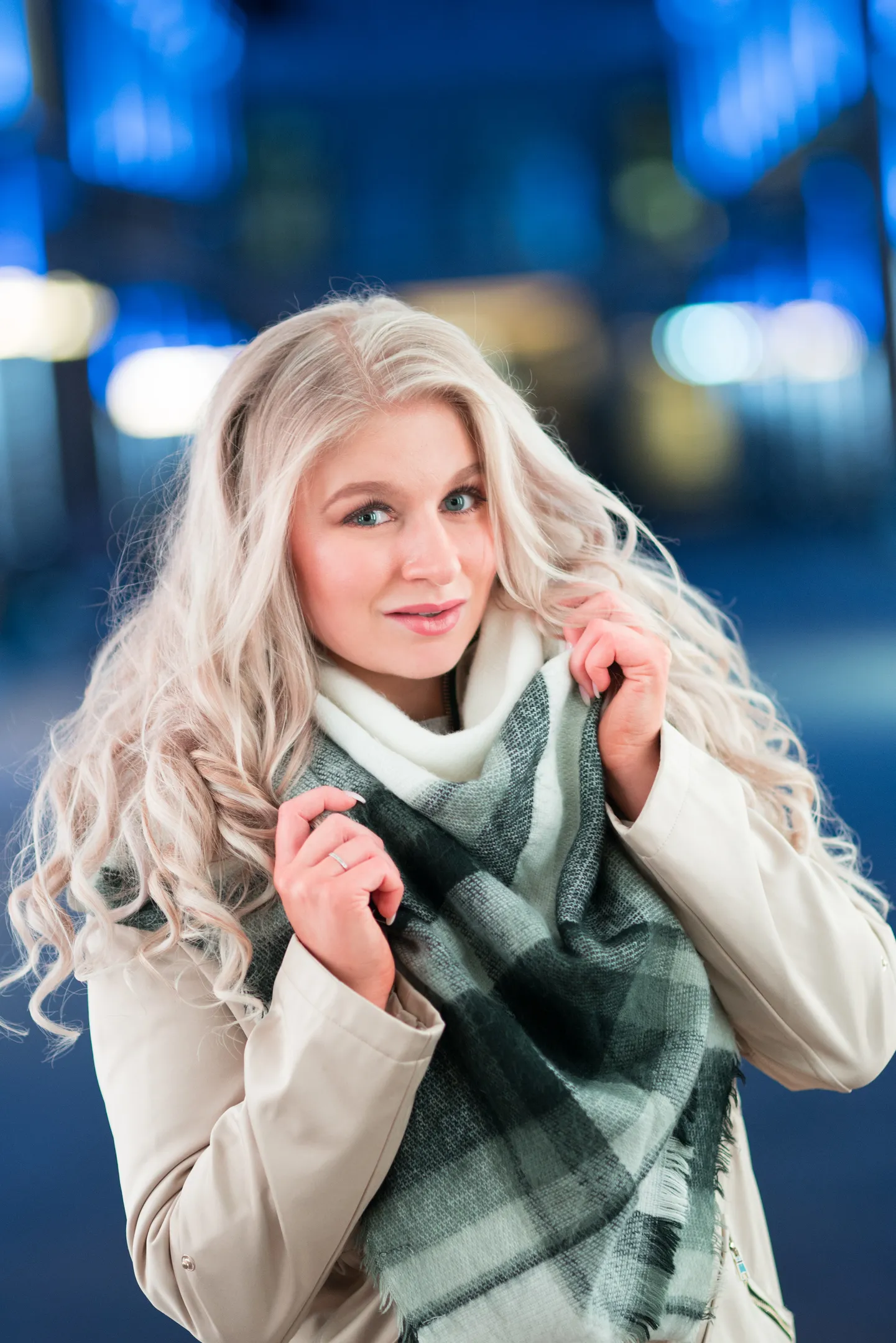 Ruth bundling scarf at night with blue city lights