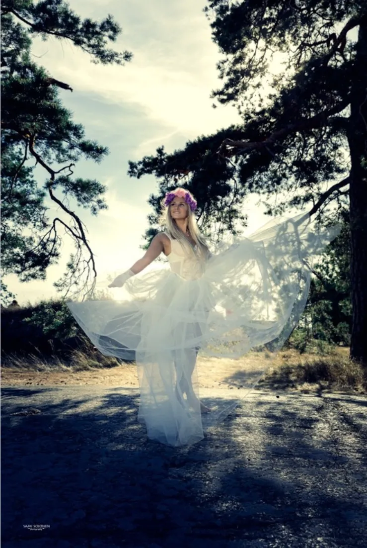 Ruth in flowing tulle among forest trees, backlit fairy-tale mood