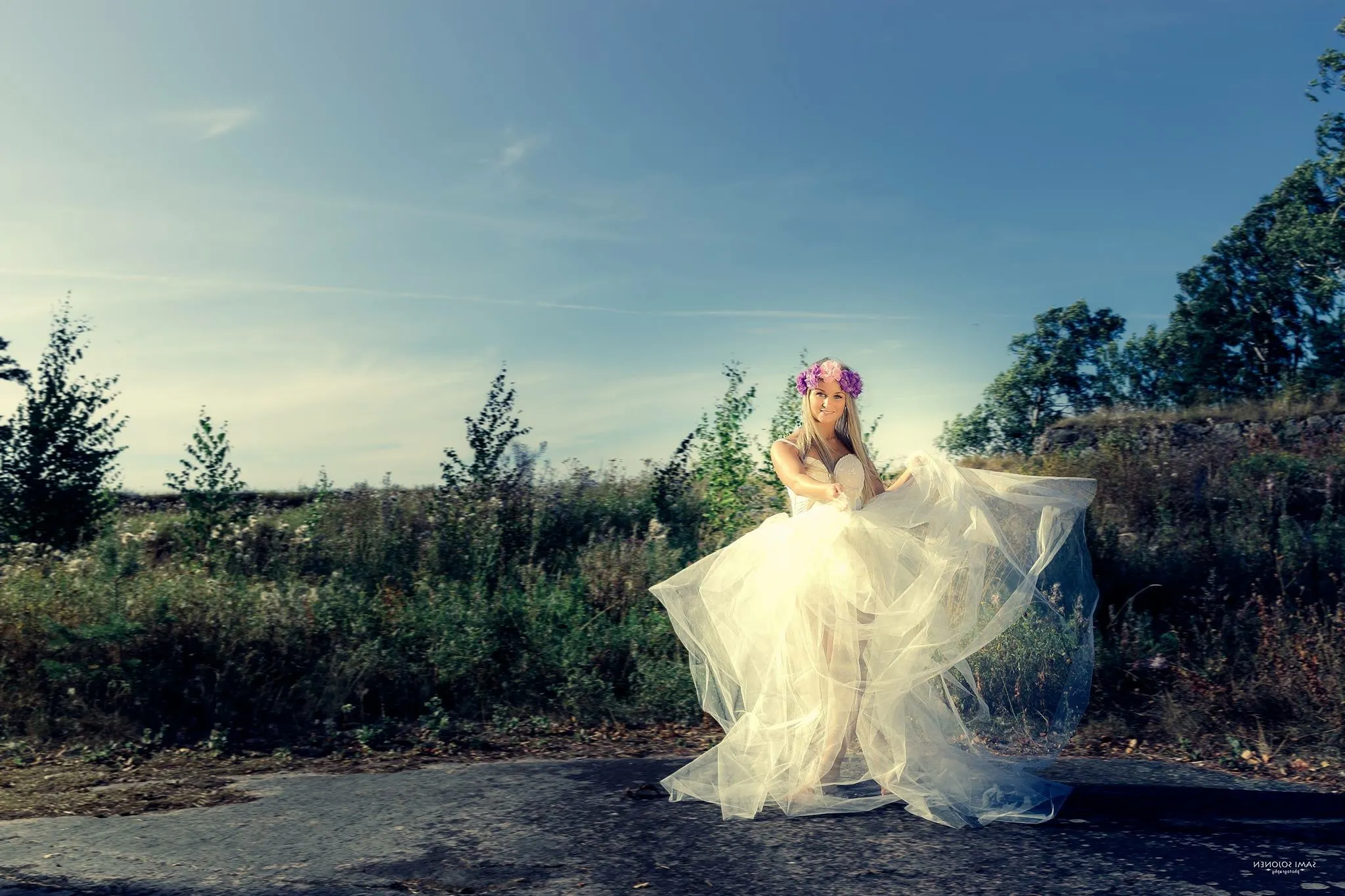 Ruth in flowing tulle on road with flower crown, golden hour