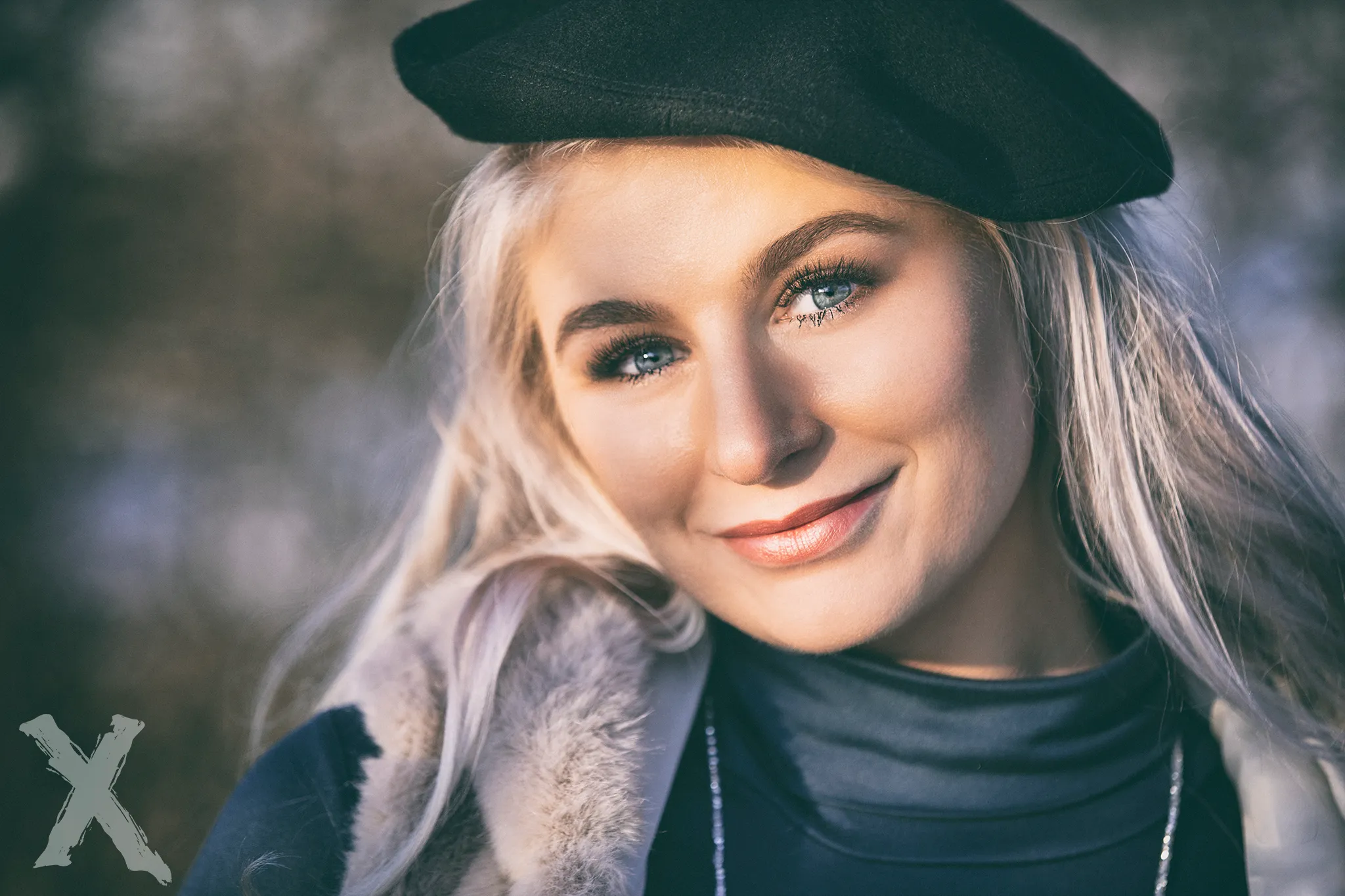 Ruth smiling in beret and fur vest, outdoor winter close-up