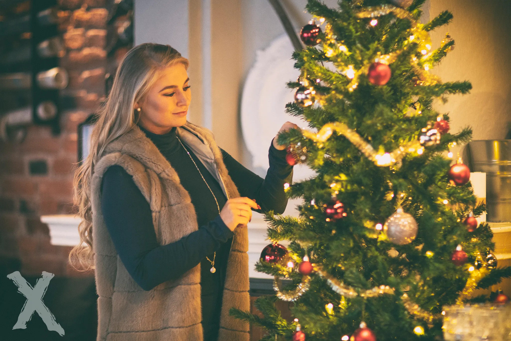 Ruth decorating Christmas tree in cozy fur vest