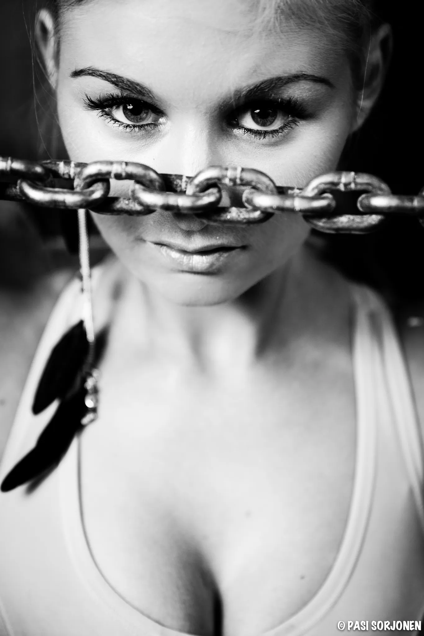 Ruth in black and white close-up with chain across her face