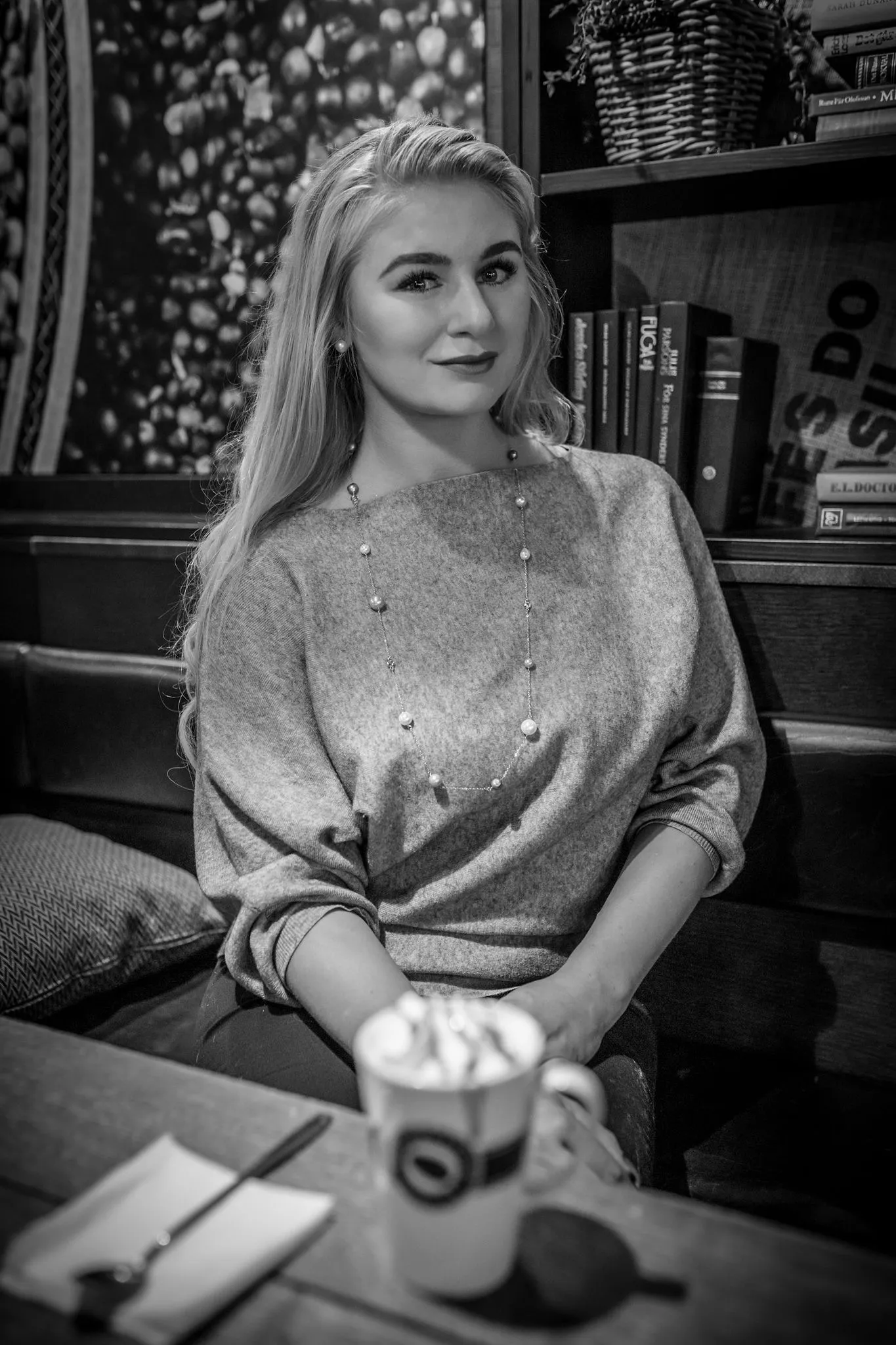 Ruth at cafe with latte, cozy mood